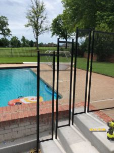 Pool safety fence on uneven elevation